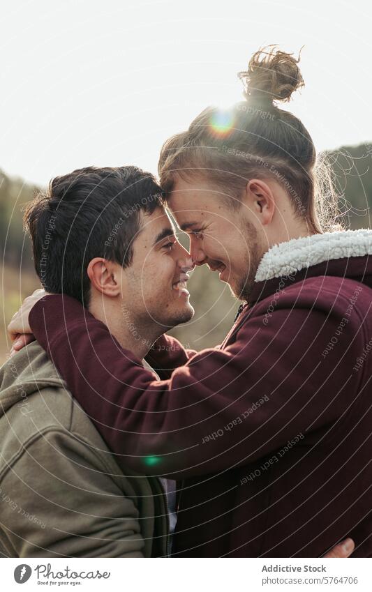 Two men share a joyful embrace, with faces close together and smiles that speak of deep connection and happiness in their relationship couple affection love