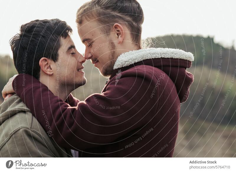 Two men share a joyful embrace, with faces close together and smiles that speak of deep connection and happiness in their relationship couple happy affection