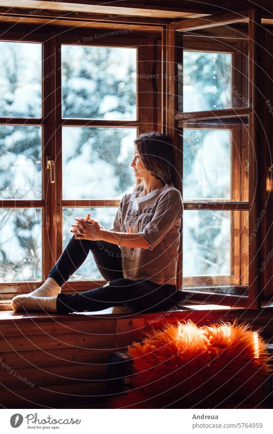 girl in the house near the window overlooking brown light family relax lifestyle indoors people happy man beauty beautiful white female attractive adult young