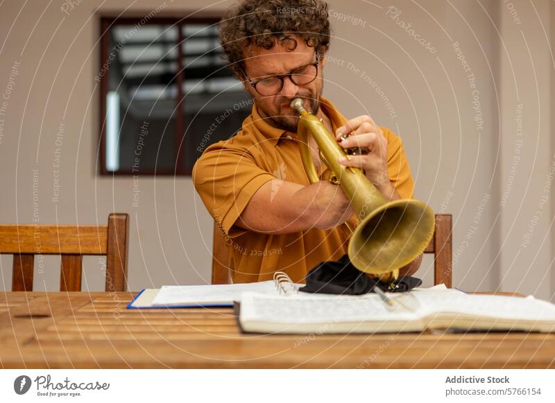 One-armed trumpeter practicing in a home courtyard one-armed musician male man practice creativity process determination instrument brass performance skill