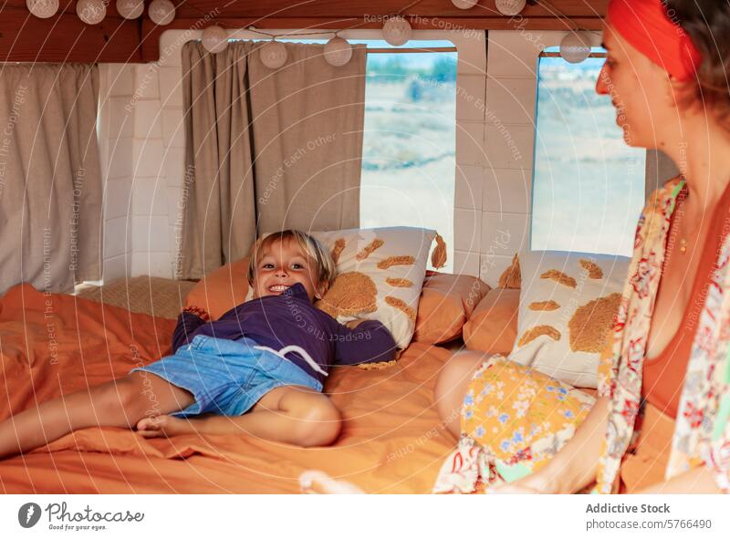 Family Living Full-time in a Cozy Van Home family van home living full-time lifestyle cozy domestic mother boy playful converted van deck facilities traveling