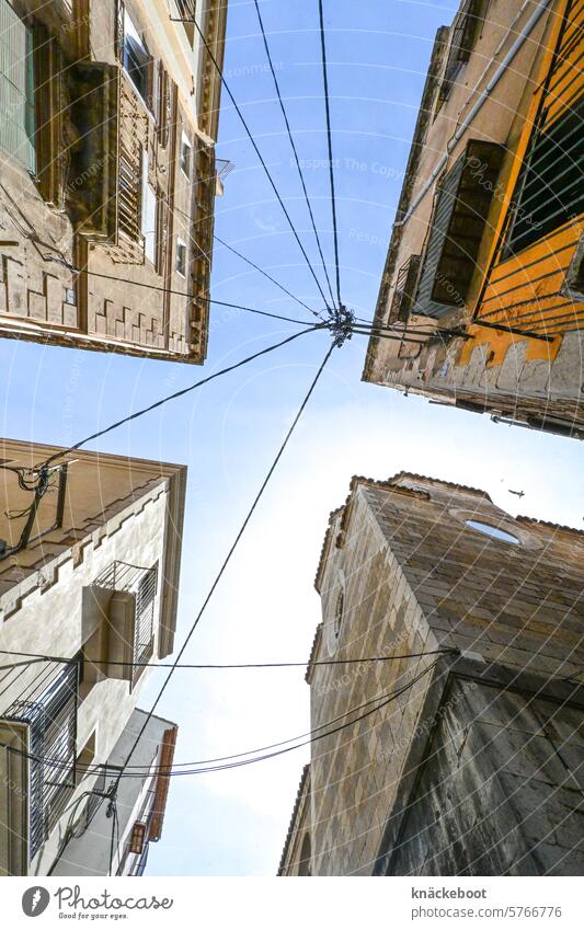 intersection of an old town Worm's-eye view Sky Architecture House (Residential Structure) Facade Manmade structures Town Building power line Spain Historic