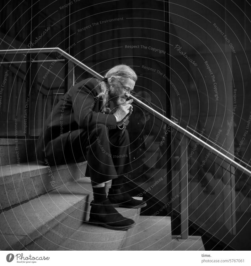 pensive man on a staircase Man Sit Stairs Glas facade Suit Gray-haired ponder Downward portrait Full-length Profile Long-haired handrail stair treads Eyeglasses