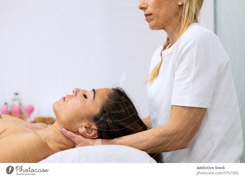 Masseuse doing a relaxing head massage adult alternative medicine beauty body care bodycare enjoyment eyes closed face facial female hand headshot healing
