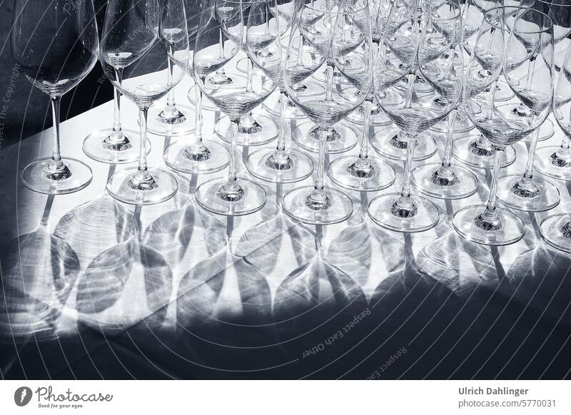 Many wine glasses on a white tablecloth with shadows Glass Vine Gastronomy abstract Pattern Light Shadow unusual shape
