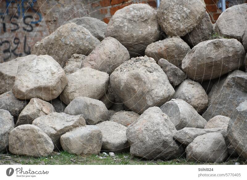many large granite boulders piled up Granite stones foundling Brocken Large Construction site Pile of stones Rock Stone Dirty Exterior shot Sand Stack Heap