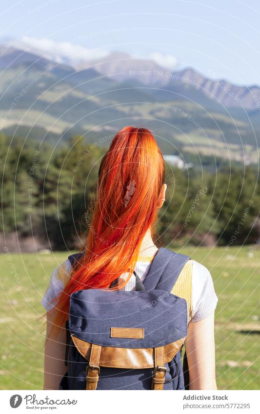 Redheaded woman enjoying scenic mountain view redhead nature mountains backpack getaway outdoors travel adventure hiking wilderness exploration leisure