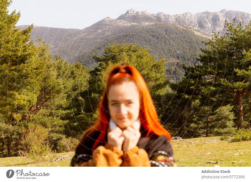 Redheaded woman enjoying a serene nature getaway portrait redheaded tranquil mountain landscape lush forest outdoors expression peaceful retreat leisure hiking