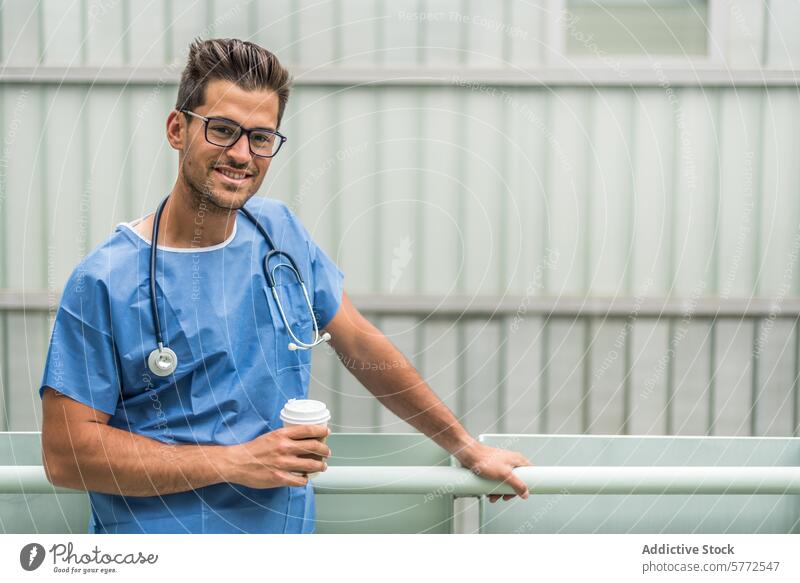 Cheerful medic drinking coffee break care clinic confidence copy space doctor emotional handsome happy healthcare joyful looking at camera male man medical
