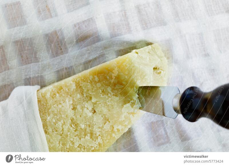 Parmesan cheese with knife food parmesan grana yellow Italian cheese parmigiano reggiano copy space gourmet traditional food delicious healthy eat ready to eat
