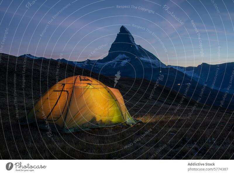 Illuminated tent with majestic Matterhorn at dusk matterhorn camping illuminated glow mountain twilight iconic background outdoor adventure travel nature alpine