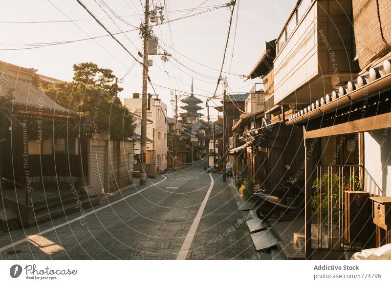 Serene morning in a traditional Japanese neighborhood japan travel street sunlight houses pagoda calm atmosphere serene culture architecture residential quiet