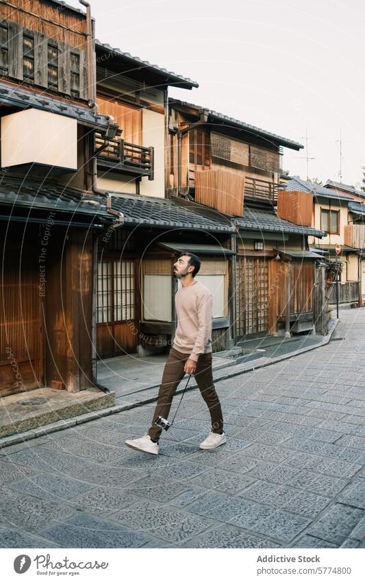 Exploring Traditional Japanese Streets as a Tourist tourist japan travel traditional street man walking camera culture architecture historic wooden neighborhood
