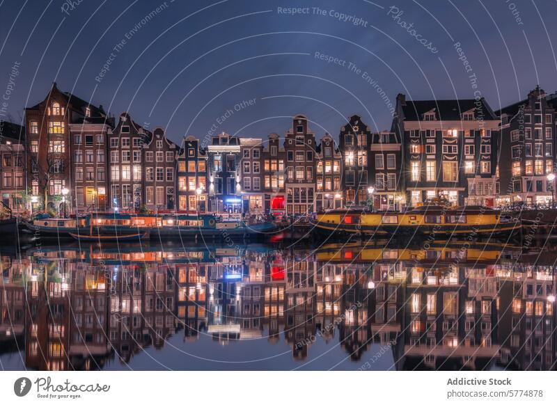 Evening reflections on Amsterdam canal amsterdam netherlands evening tranquil illuminated house water still typical architecture cityscape travel tourism dutch
