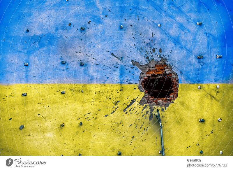 explosion damaged blue yellow house wall war in Ukraine Donetsk Kharkov Kherson Lugansk Mariupol Russia abandon attack bahmut blown up bombardment broken