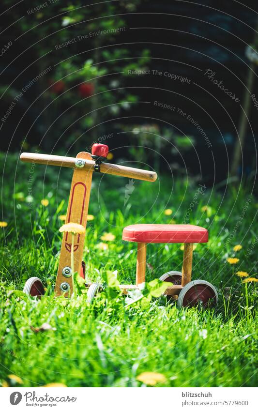 An old wheel in detail impeller Child Bicycle Infancy Toddler Playing Cycling Movement Leisure and hobbies Old Wheel Toys Close-up Detailed recording Mobility