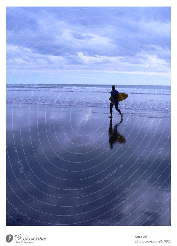 surfer's paradise Surfer Beach Ocean Clouds Sky Surfing Moody Mirror Reflection Horizon Sports Cold Far-off places Wanderlust Calm Passion Gale Waves Low tide