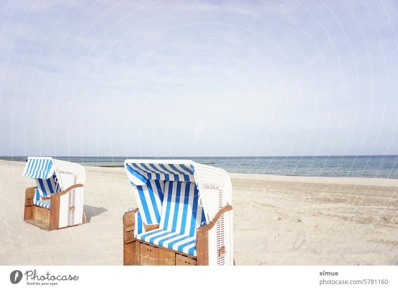 two open beach chairs on the Baltic Sea beach Beach chair Ocean blue and white striped Stripe bank Mecklenburg-Western Pomerania Sand Sandy beach Blog