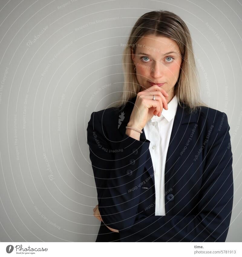 Woman in jacket Blonde portrait Feminine Hand Skeptical Looking Looking into the camera test Long-haired Hend Jacket Businesswomen Jewellery
