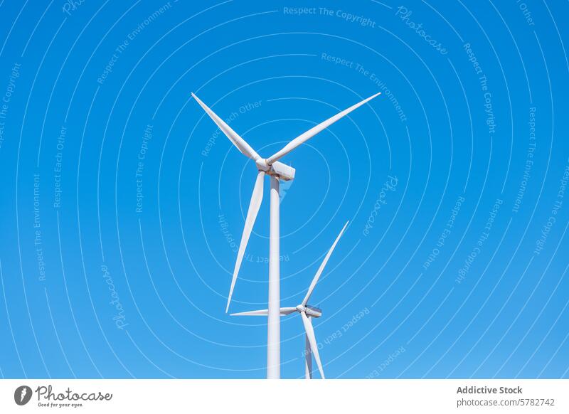 Sustainable energy from wind turbines against blue sky renewable energy sustainable technology environmental clean power electricity generator wind farm