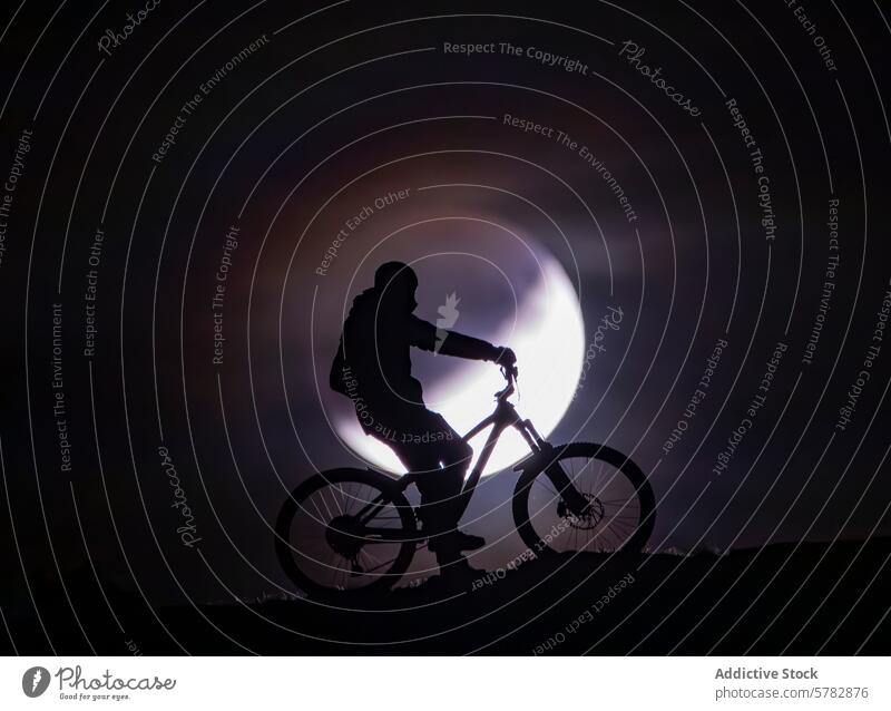 Summer night cycling with full moon silhouette cyclist mountain bike adventure summer ride bicycle sky outdoor activity leisure sport biking moonlight evening