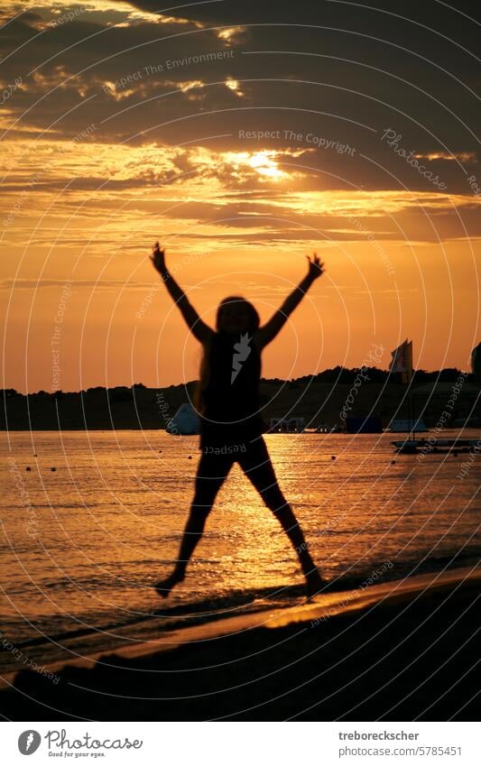X Silhouette of a jumping child on the beach Child youthful Jump Form (document) Beach Sun fun Sports Fitness Black Shadow Light Evening Sunset Ocean Water