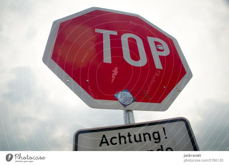 Attention! TOP street sign Stop sign Change Top Street art Vandalism Creativity Characters Traffic infrastructure Road sign Sky cloudy Back-light stickers