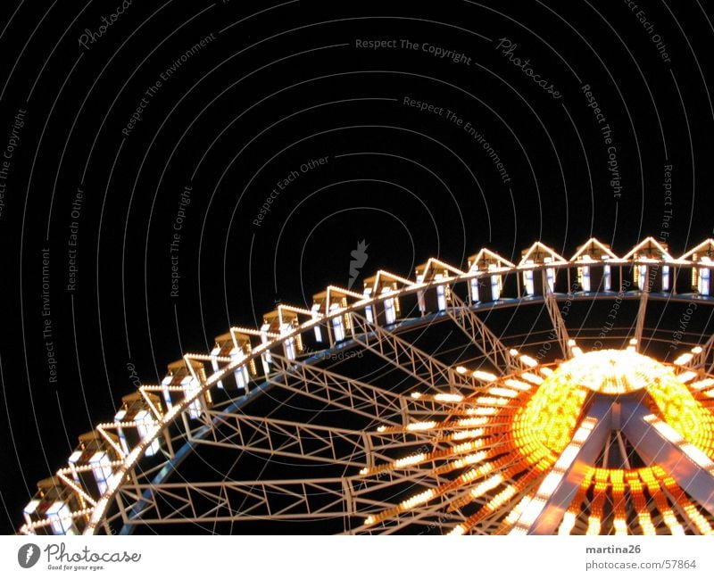 centrifuges Ferris wheel Fairs & Carnivals Light Night Yellow Red Leisure and hobbies Theme-park rides Joy Exterior shot Illumination Carousel Neon light