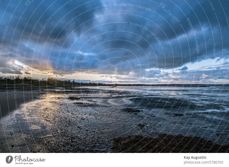 On the Wadden Sea on the Wadden Sea evening mood Sunset North Sea coast Mud flats Cloud pattern Weather Raincloud North Sea Islands ebb and flow Tide wide
