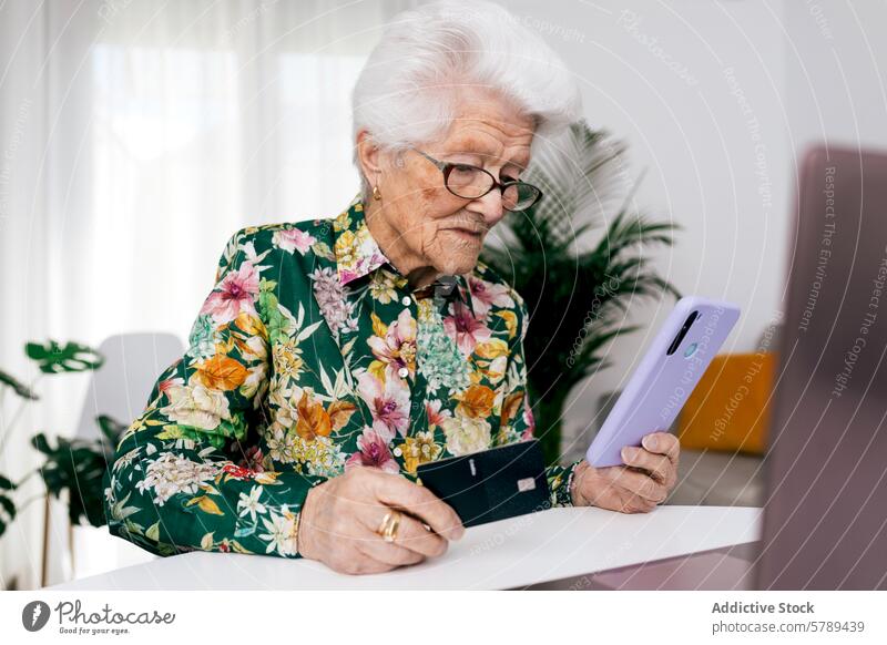 Elderly Woman Managing Finances at Home elderly woman finance smartphone credit card home floral shirt managing indoor senior technology online banking payment
