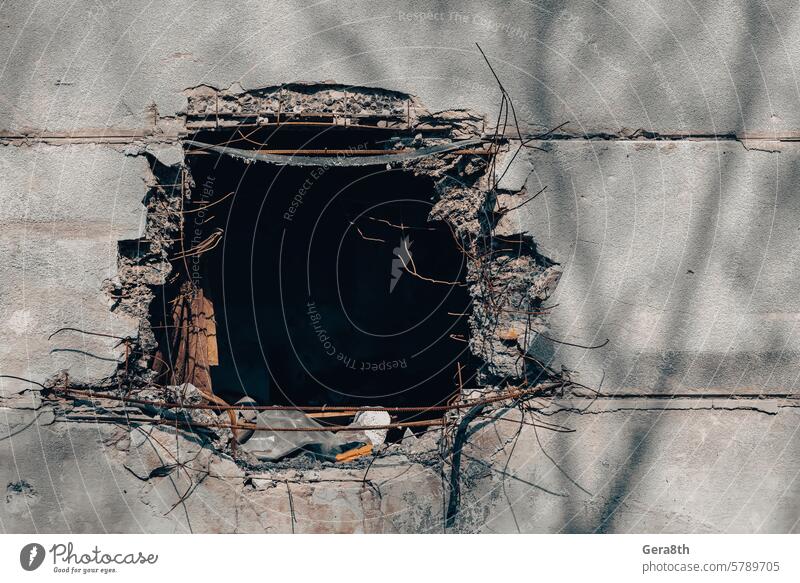 hole in the wall of a house from a bomb hit in Ukraine Donetsk Kherson Lugansk Mariupol Russia abandon abandoned attack blown up bombardment broken building