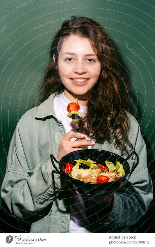 Woman enjoying a fresh Caesar salad with chicken woman caesar tomato eating healthy meal bowl happy leafy greens cherry tomatoes parmesan croutons joyful