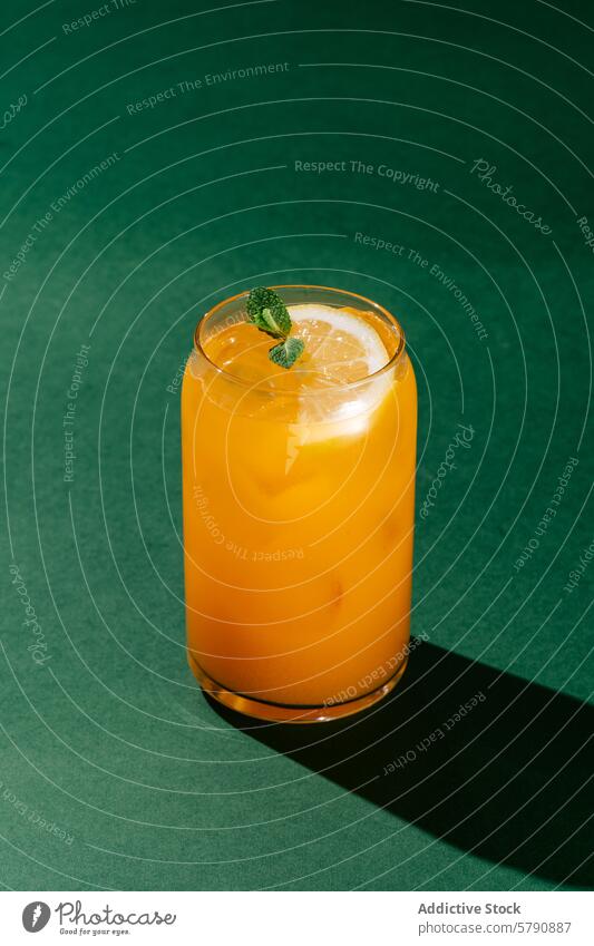 Refreshing Berry-Orange Lemonade on Green Background berry-orange lemonade mint slice glass refreshing drink beverage non-alcoholic garnish cold citrus summer