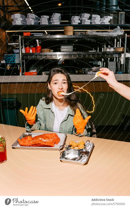 Woman in gloves eating with excitement at a diner woman mozzarella balls casual bloody mary potato dips food drink cheese table dining snack appetizer meal