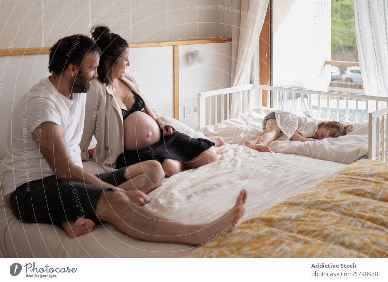 Tender family scene with pregnant mother woman partner child sleeping tender moment bedroom maternity parenthood love care relaxation togetherness comfort