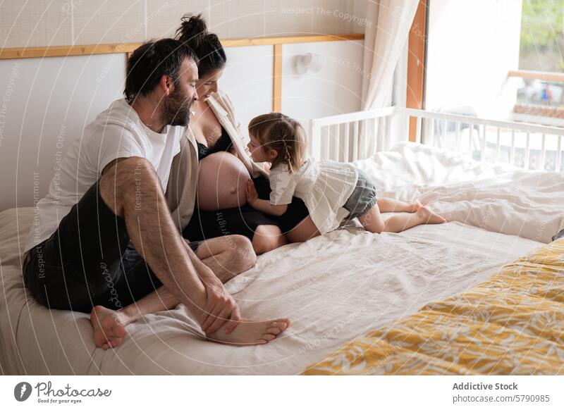 Expectant couple with toddler on a cozy morning family pregnant mother father bed sunlit home intimacy parenthood maternity lifestyle love affection