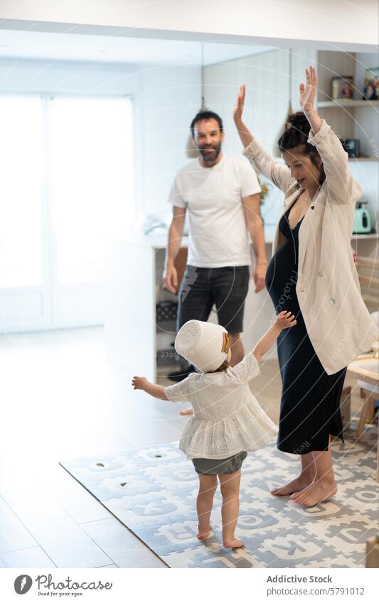 Toddler engaging with pregnant mother at home family toddler father child parent maternity pregnancy joy happiness modern interior playful bonding interaction