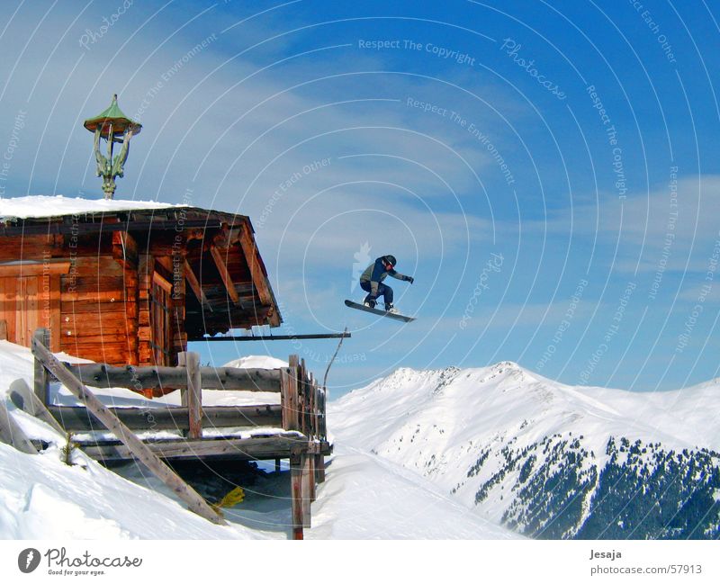 ski-bound Snowboard Winter Jump Ski hut Vacation & Travel Wooden hut Austria Snowboarder Hut Mountain Alps Tall Snowboarding Crazy far Roof Wooden house