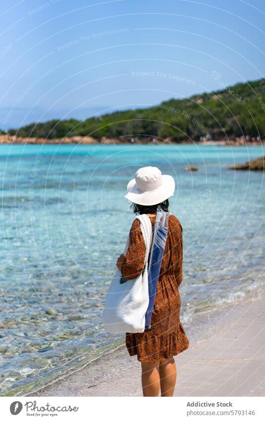 Traveler enjoying Sardinia's serene beach scenery, Grande Pevero Beach woman traveler sardinia italy sea clear water white sand natural tourist summer vacation