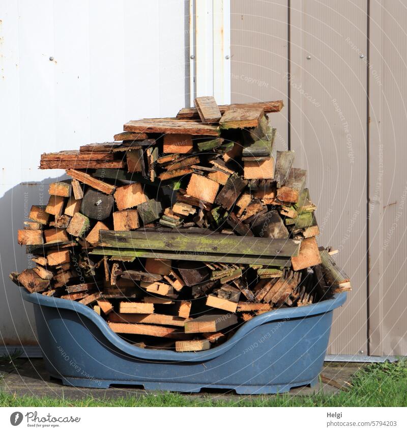 Wood supply for the fire bowl wood supply tub receptacle Logs wood pieces Firewood Fuel Stack of wood Supply stacked Wall (building) Sunlight Beautiful weather