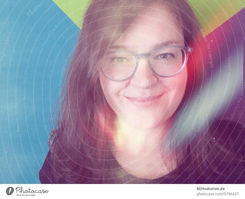 Woman with glasses smiling into the camera - Portrait portrait Young woman Adults Human being Face Smiling Joie de vivre (Vitality) Friendliness Contentment