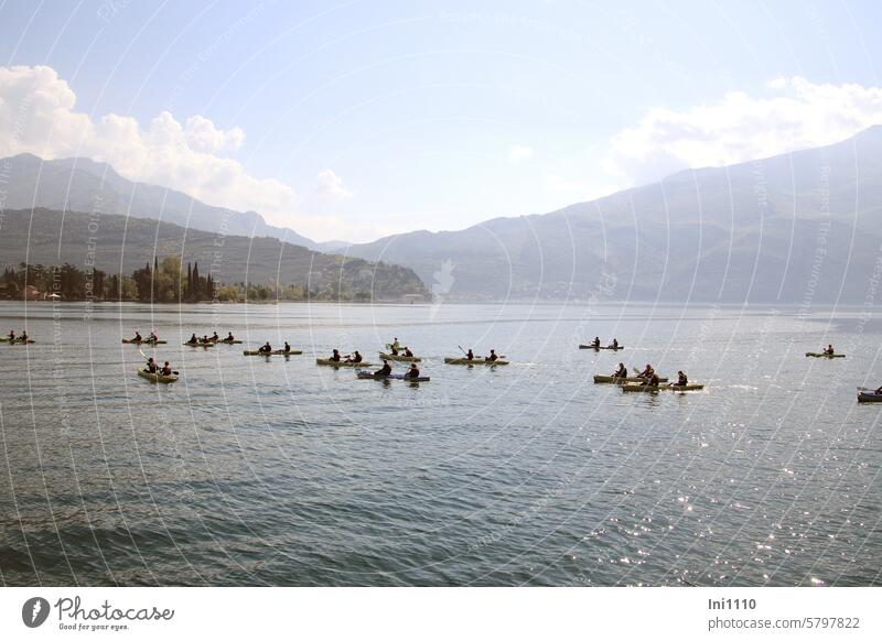 Paddling on Lake Garda Landscape Northern Italy Water sparkle free time hobby pleasure people group Paddle Sports paddle tour Aquatics Double paddle two-seater