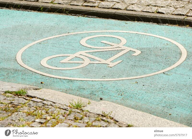 Green cycle path with pictogram of a bicycle between paved paths Street Ride a bike! Cycling wheel track Pictogram Road traffic Lane markings Cycle path Blog