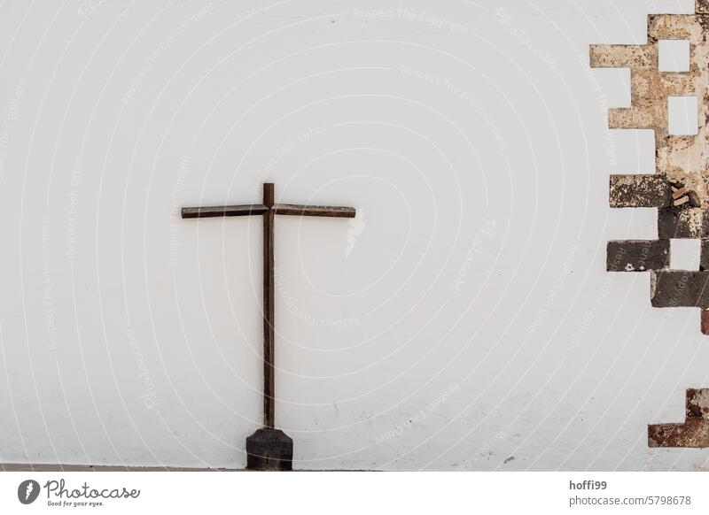 religious cross on a white wall Crucifix symbol Christianity Religion and faith Belief religion Church Symbols and metaphors Christian cross Spirituality God