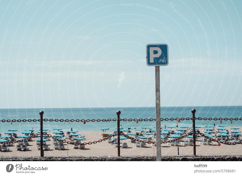 Sign for a parking lot for bicycles on the beach Signage Bicycle lot Beach beach promenade Parking Bicycle rack Means of transport Town Exterior shot Cycling