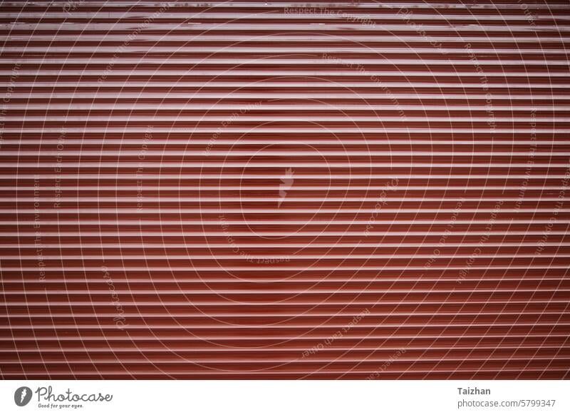 Metalic commercial roll up door texture . Horizontal shot , copy space abstract background blank blinds closed color cover design detail dirty entrance folding