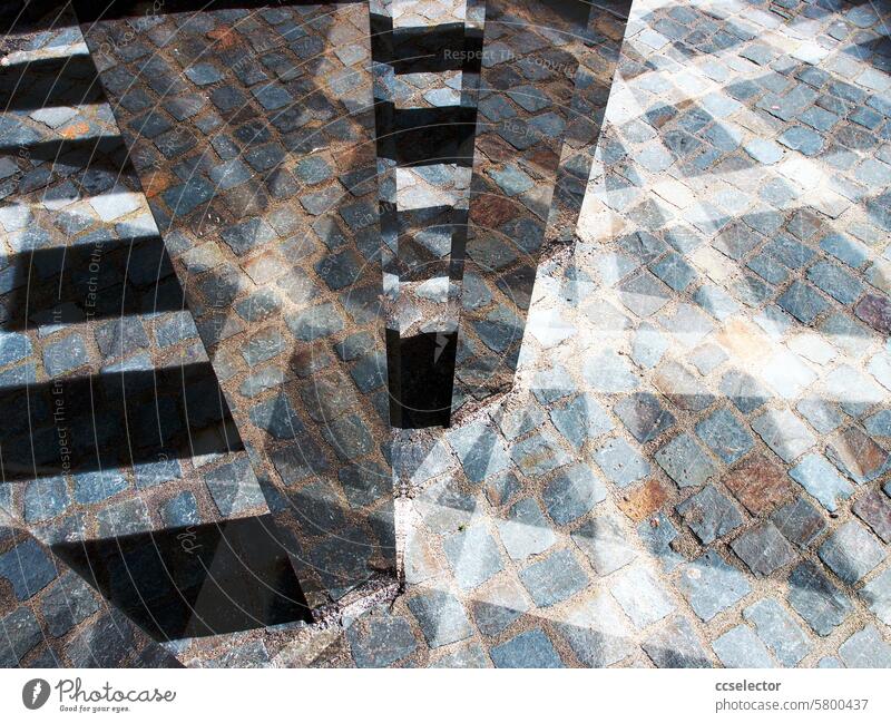 Light reflections on cobblestones Reflections Exterior shot Deserted urban Town public space Abstract abstraction