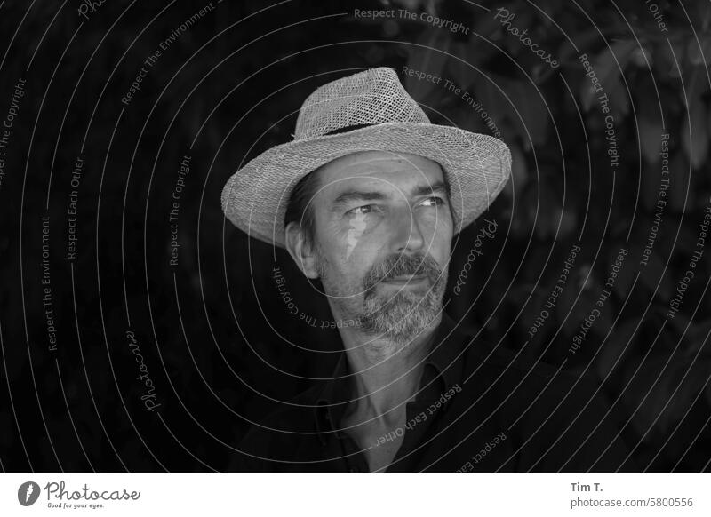 Man with hat Hat b/w Summer Straw hat Black & white photo Day B/W Exterior shot B&W Berlin Calm Town Loneliness Facial hair Beer garden bnw