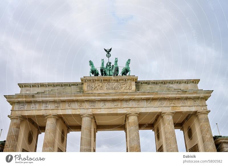 Brandenburg Gate in Berlin, Germany pariser platz architecture historical landmark sculpture culture cloudy capital monument brandenburger tor famous tourist