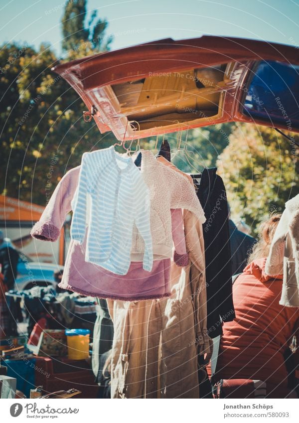 used clothes hangs on car at the flea market Lifestyle Style Fashion Clothing T-shirt Shirt Sweater Jacket Coat Hip & trendy Uniqueness Flea market Sell Stall